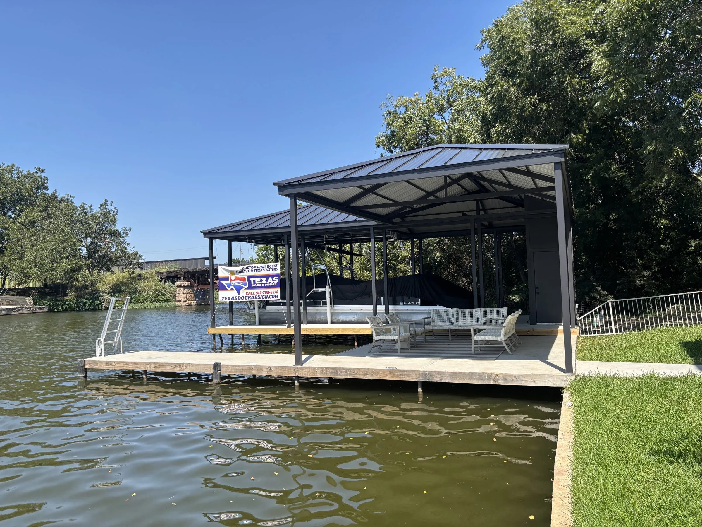 Stationary dock with covered patio seating and a boat slip
